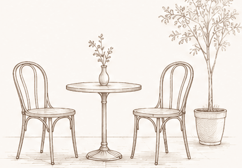 Two chairs at a small table